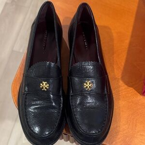 Salvatore Ferragamo Black Loafers with Gold Emblem